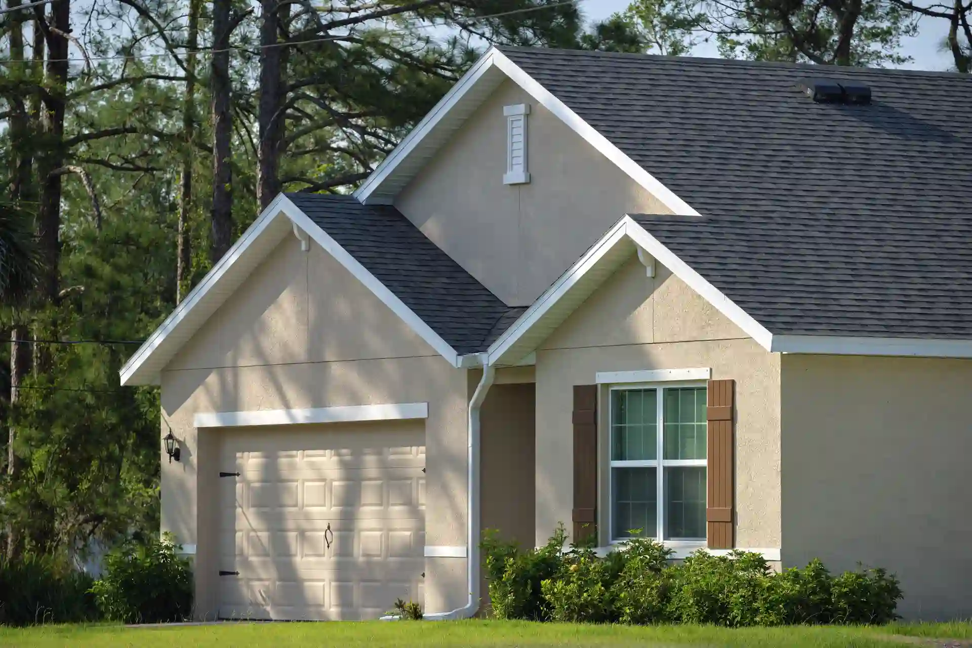 wide-garage-double-door-and-concrete-driveway-of-n-2023-11-27-05-06-15-utc-2-1